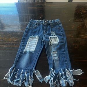 Distressed Blue Denim Jeans